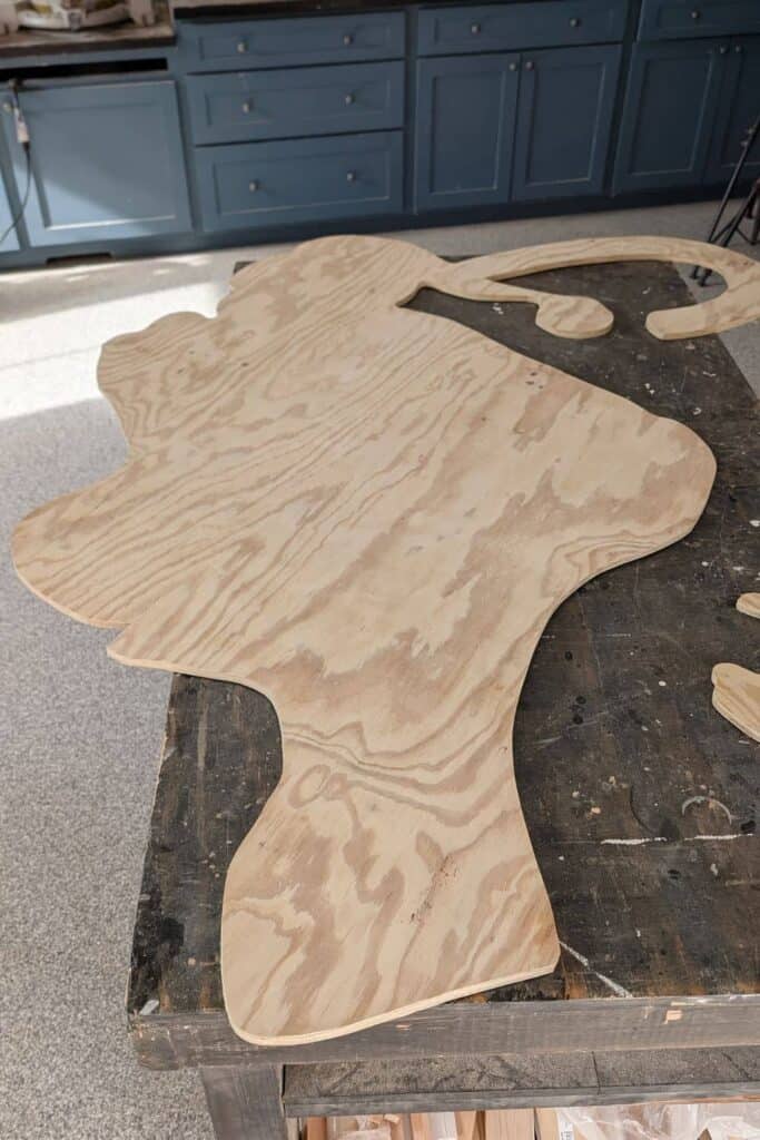 plywood panel after cutting out the outline for the Grinch