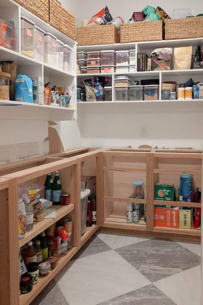 DIY lower cabinets installed in pantry with checkered tile