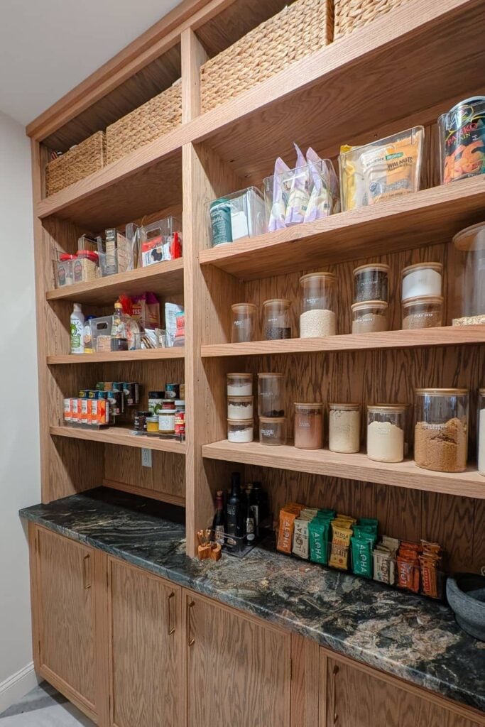 DIY pantry with wood hutches for food storage and lower cabinets with skinny shaker doors