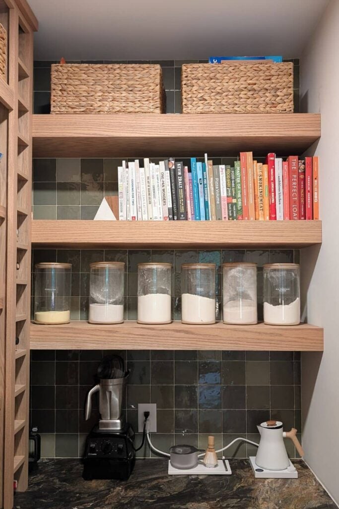 DIY floating shelves made from red oak with green tile backsplash