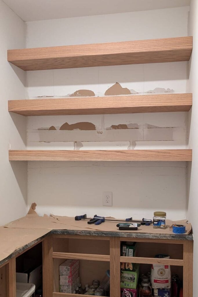 DIY floating shelves for pantry made from red oak 