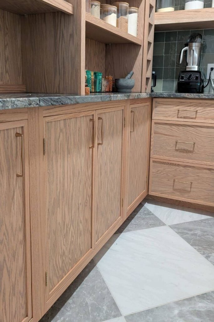 close up of DIY skinny shaker doors in custom pantry
