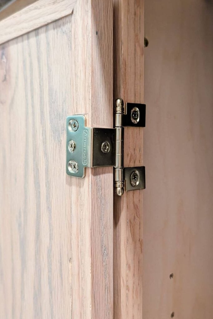 close up of hinge for DIY inset cabinets with skinny shaker doors